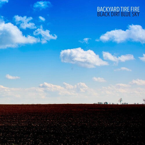 Backyard Tire Fire: Black Dirt Blue Sky